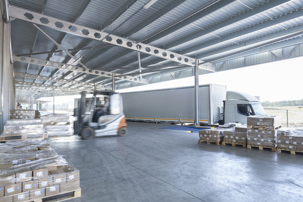 forklift on loading dock with semi trailer