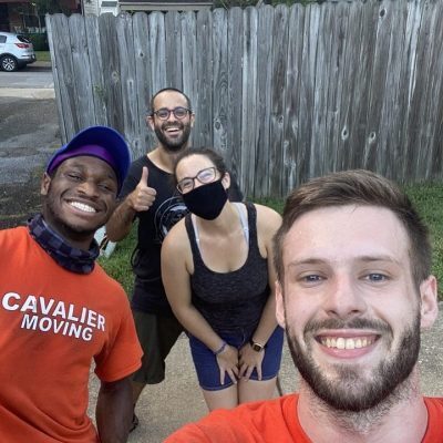 Pictured: Cavalier Moving team members taking a photo with some customers.
