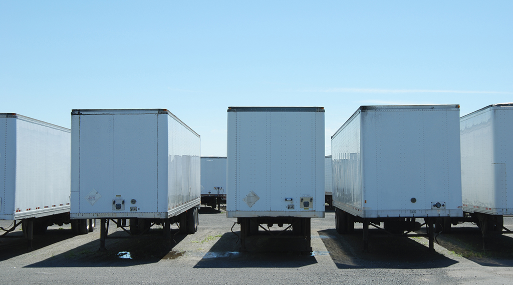 semi trailers parked in a line