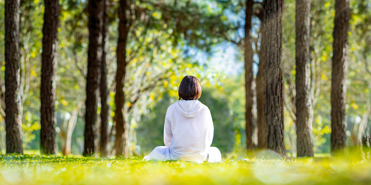 woman sitting in field