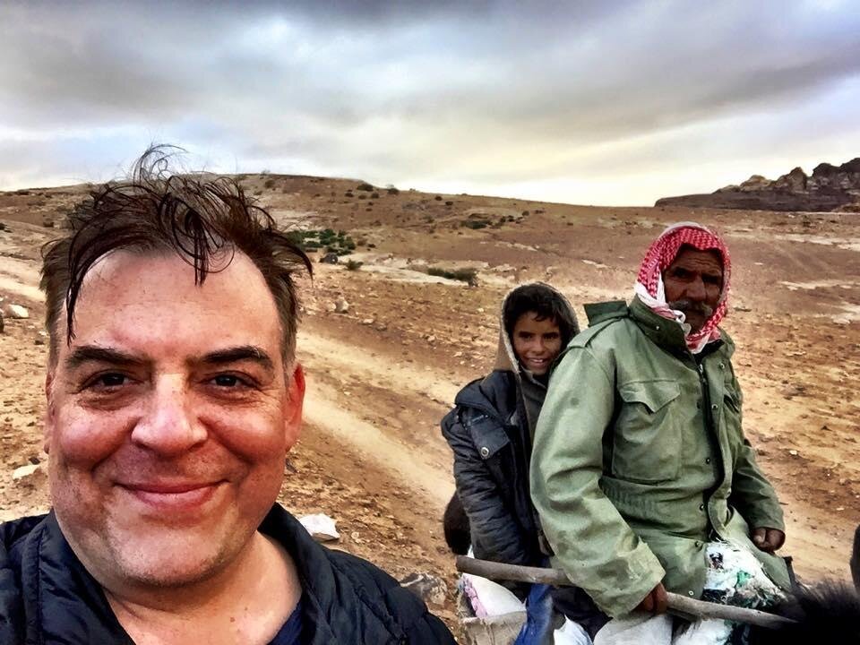 A person taking a selfie with a group of people AI-generated content may be incorrect.