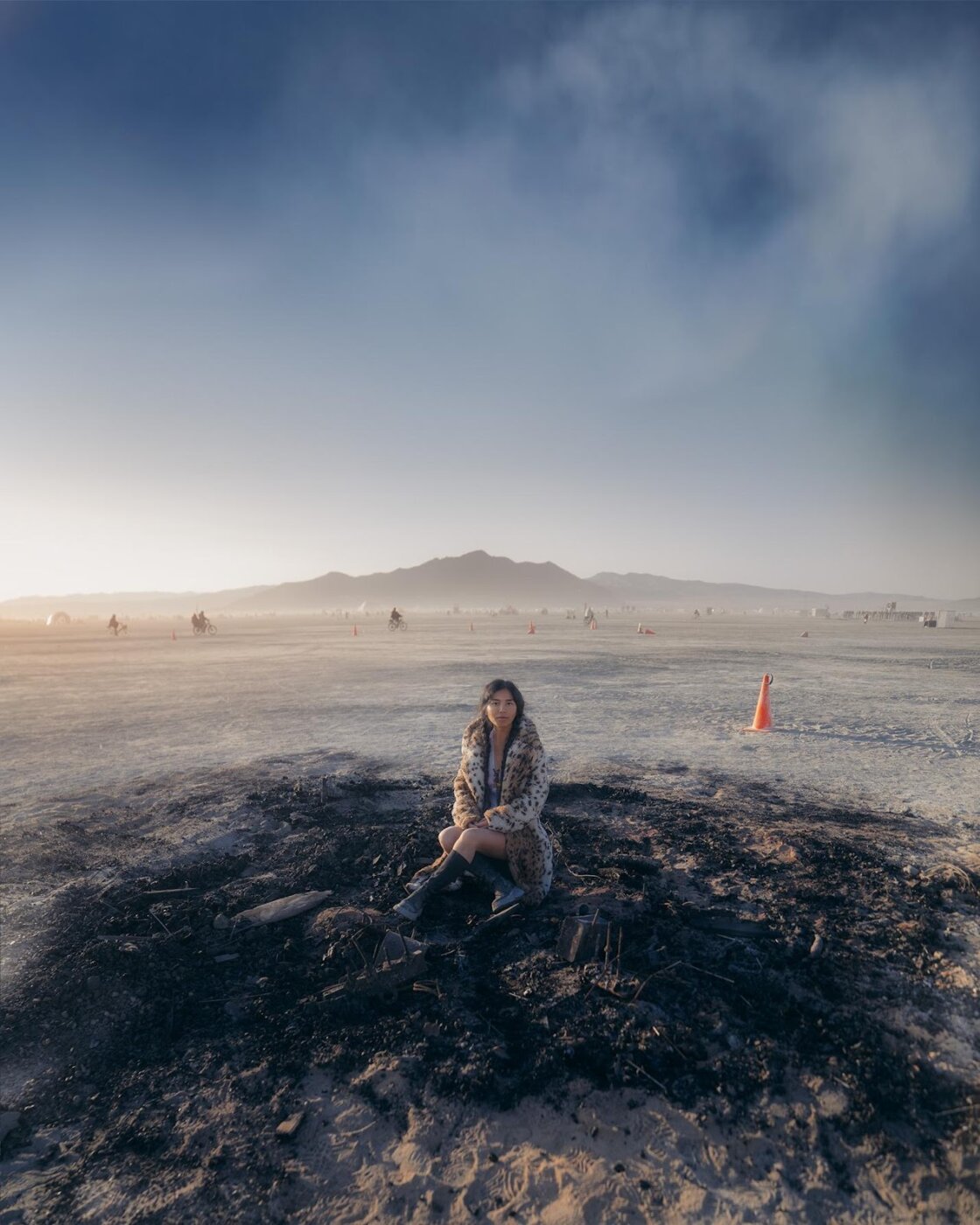 A person sitting in a pile of dirt AI-generated content may be incorrect.
