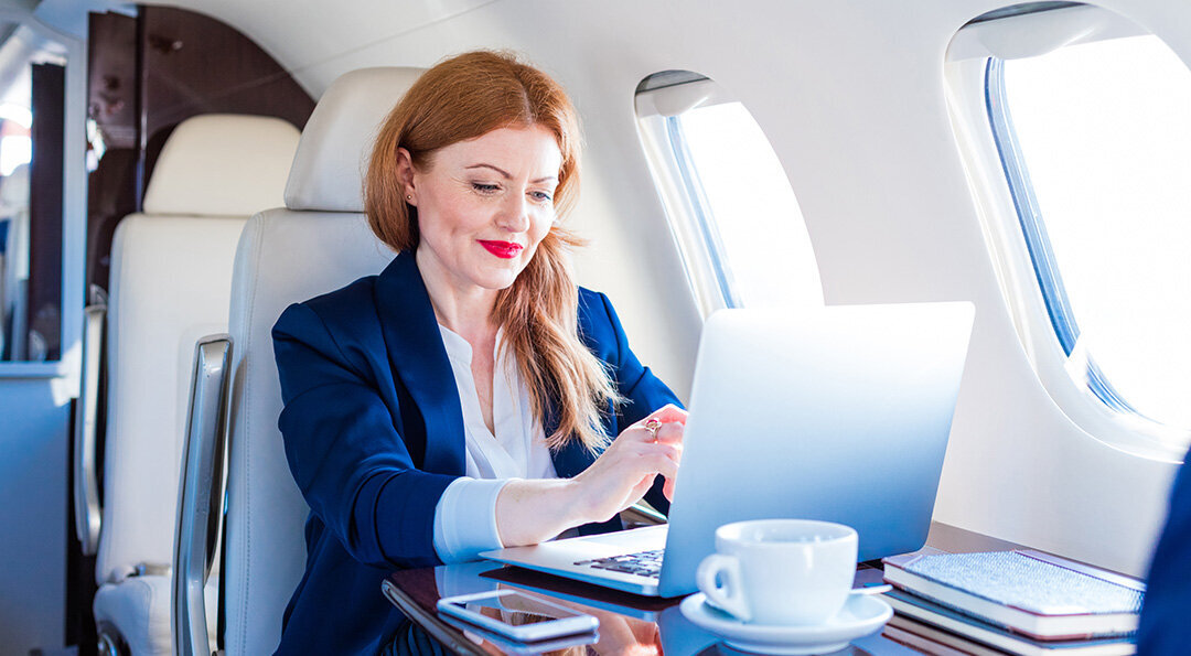 woman working on a private jet