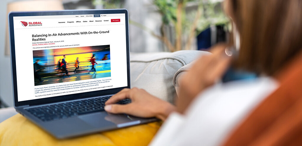 woman reading article on laptop