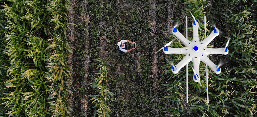 farmer using using drone to spray crops