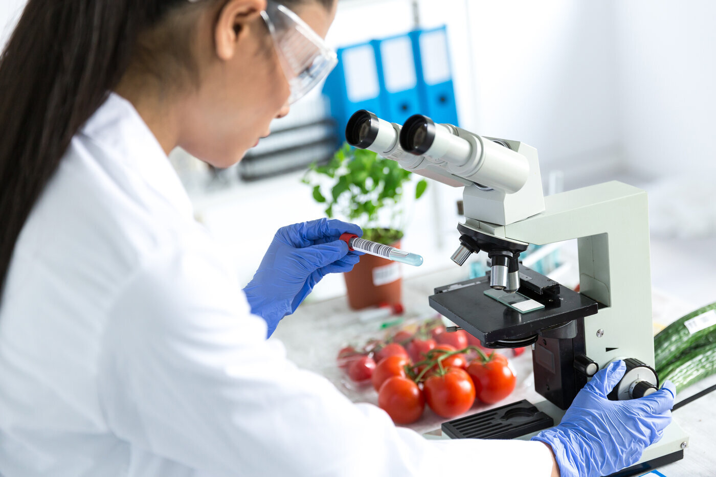 scientist using microscope