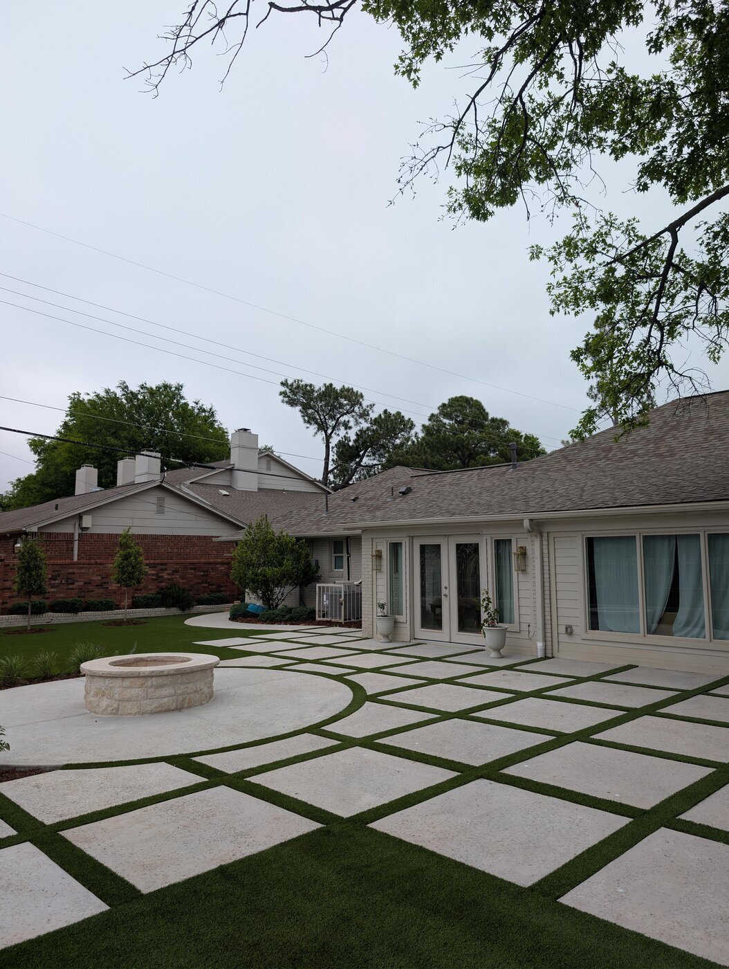 New Nature Turf & Landscape works where Oklahoma yards move beyond conventional lawn care into built and planted outdoor spaces.