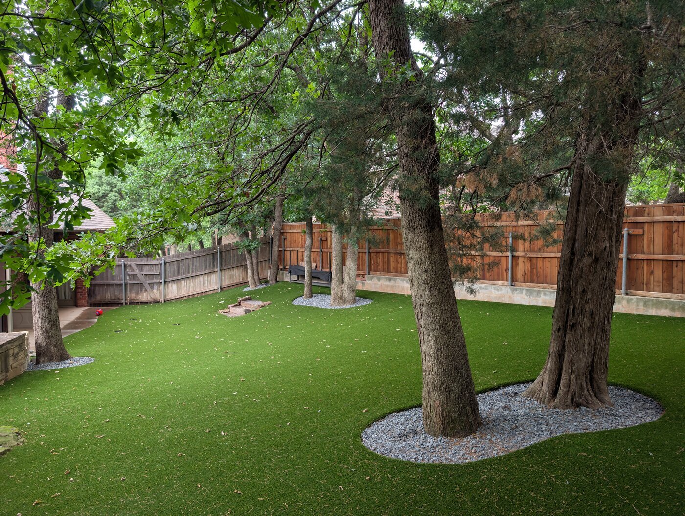 New Nature Turf & Landscape works where Oklahoma yards move beyond conventional lawn care into built and planted outdoor spaces.