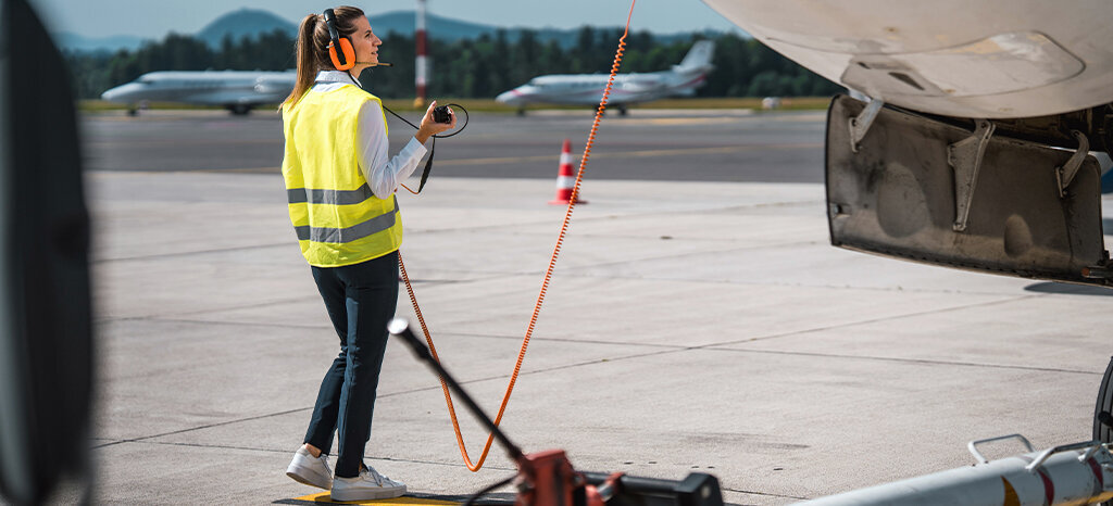 woman conducts a systems check on aircraft